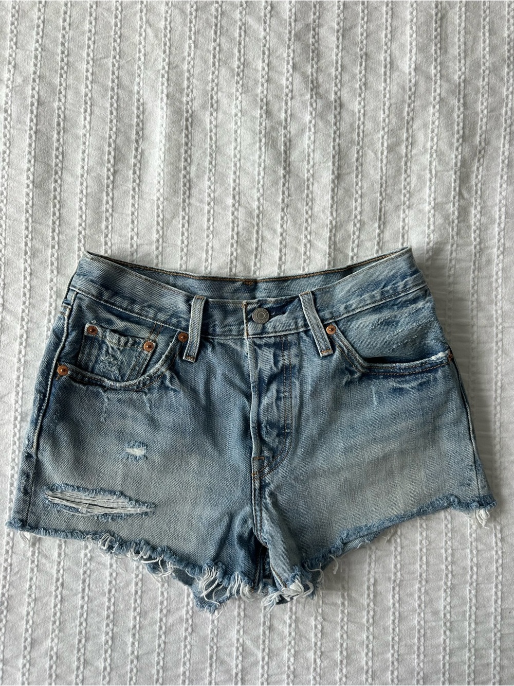 Levi’s: Light Blue Distressed Denim Shorts